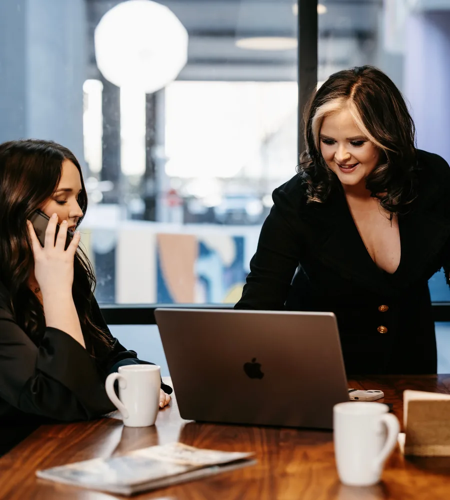 Hannah Blevins and Caroline Parker reviewing a file